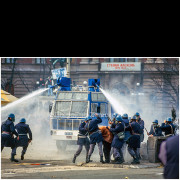 Clashes between demonstrators and police during the protests of March 9, 1991, in Belgrade. A police water cannon is used to disperse the crowd at Republic Square. The photograph was taken at the moment of escalation, when the city center turned into a zone of open confrontation.