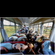 In August 1992, a large-scale exchange of war prisoners between Serbian and Croatian forces was carried out under the operation known as “All for All.” The exchange began in the village of Sarvaš, where several buses containing Croatian prisoners were assembled, and continued toward Nemetin.
This photograph was taken inside one of the buses during the transport of prisoners. It shows exhausted men with bowed heads in a confined space, under military supervision. The interior scene documents the physical and psychological condition of prisoners immediately before or after the exchange.
The event was one of the more significant organized prisoner exchanges during the wars in Croatia and Bosnia and Herzegovina in 1992. The image serves as a documentary record of a single moment within that process, without insight into the individual outcomes for those depicted.